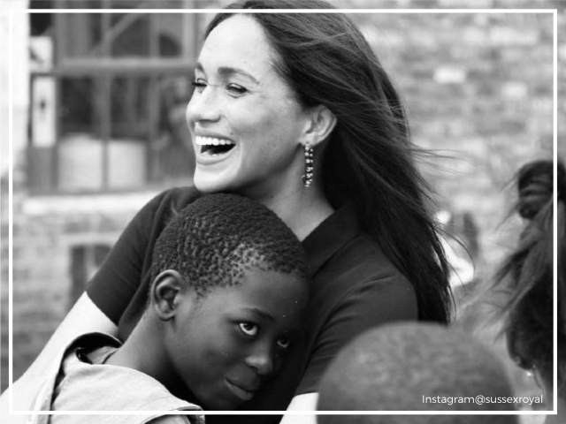 Meghan Markle hugs a kid in S. Africa